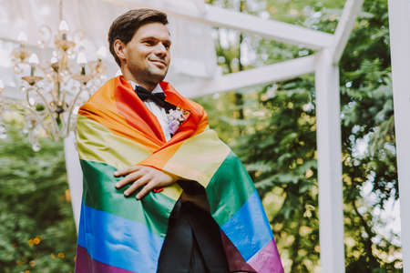 Homosexual couple celebrating their own wedding - LBGT couple at wedding ceremony, concepts about inclusiveness, LGBTQ community and social equityの写真素材