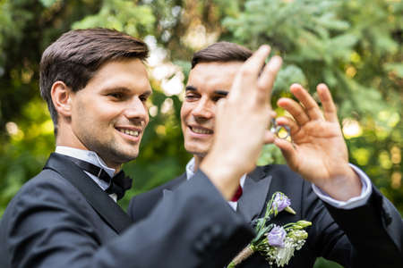 Homosexual couple celebrating their own wedding - LBGT couple at wedding ceremony, concepts about...