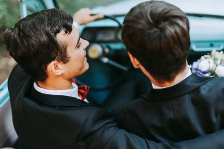 Homosexual couple celebrating their own wedding - LBGT couple at wedding ceremony, concepts about inclusiveness, LGBTQ community and social equityの写真素材