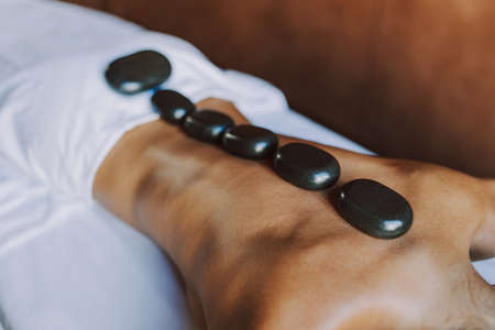 Beautiful woman relaxing in a beauty spa hotel - Client having a beauty treatment in a beauty spa salonの写真素材