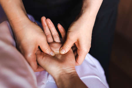 Beautiful woman relaxing in a beauty spa hotel - Client having a beauty treatment in a beauty spa salonの写真素材