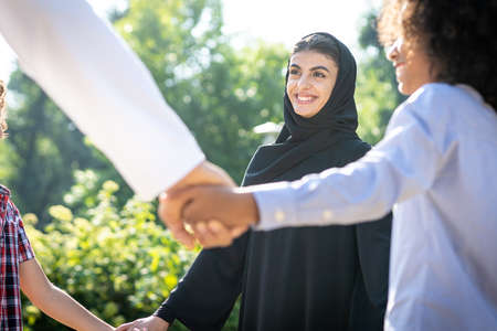 Cinematic image of a family from the emirates spending time at the park
