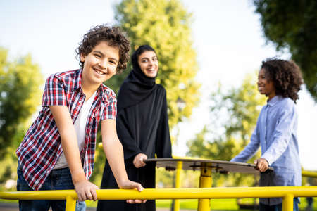 Cinematic image of a family playing at the playground in Dubaiの写真素材