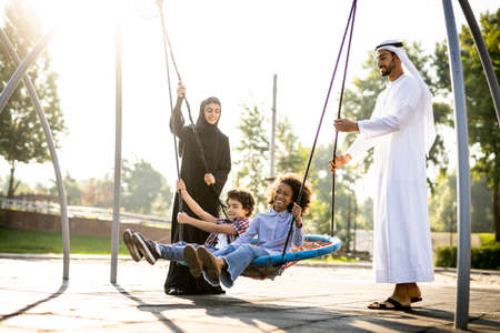 Cinematic image of a family playing at the playground in Dubaiの写真素材