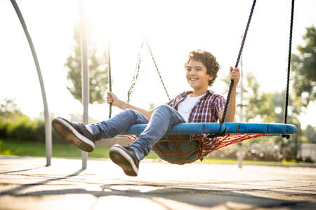 cinematic image of children playing at the playgroundの写真素材