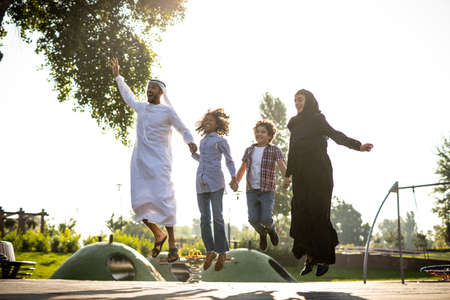 Cinematic image of a family playing at the playground in Dubaiの写真素材