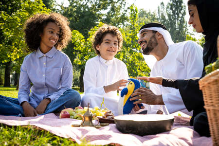 cinematic image of a family from the emirates spending time at the parkの写真素材