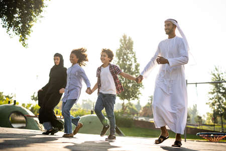 Cinematic image of a family playing at the playground in Dubaiの写真素材