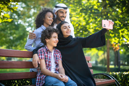 Cinematic image of a family playing at the playground in Dubai