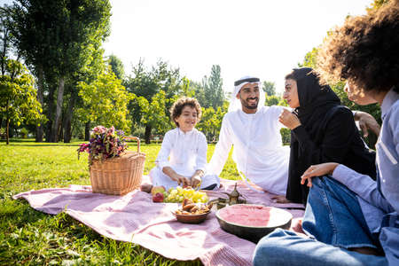 cinematic image of a family from the emirates spending time at the parkの写真素材