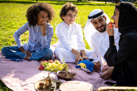 cinematic image of a family from the emirates spending time at the parkの写真素材