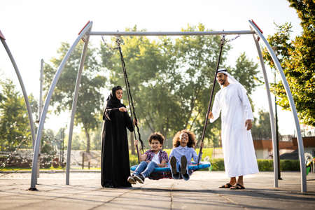 Cinematic image of a family playing at the playground in Dubaiの写真素材