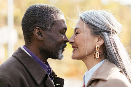 Storytelling image of a multiethnic senior couple in love