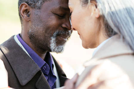 Storytelling image of a multiethnic senior couple in love