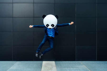 Storytelling image of a man having fun wearing a funny costumeの写真素材