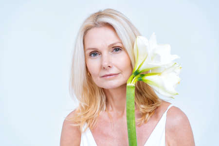 Beautiful middle aged woman posing in lingerie for a body positive and beauty photoshootingの写真素材