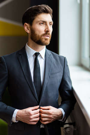 Businessman with elegant suit in the office -Handsome caucasian adult man, concepts about business and peopleの写真素材