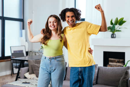 modern multiethnic unstereotyped couple lifestyle moments at home. Not stereotyped boyfriend and...