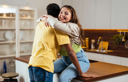 modern multiethnic unstereotyped couple lifestyle moments at home. Not stereotyped boyfriend and girlfriend living together. True love conceptsの写真素材