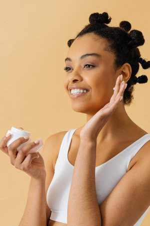 Beauty portrait of beautiful black woman wearing lingerie underwear - Pretty african young woman posing in studio, concepts about beauty, cosmetology and diversityの写真素材