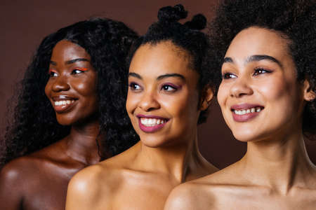 Beauty portrait of beautiful black women wearing lingerie underwear - Pretty african young women posing in studio, concepts about beauty, cosmetology and diversityの写真素材