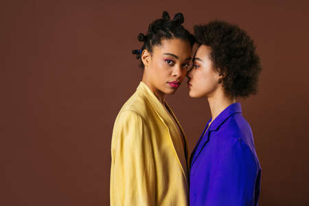 Beauty portrait of beautiful black women wearing lingerie underwear and colored blazers - Pretty...