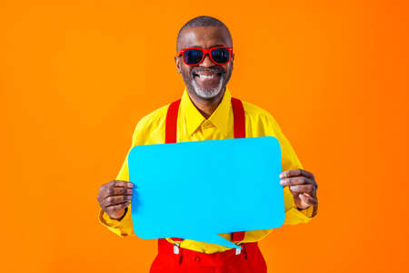 Cool senior man with fashionable clothing style portrait on colored background - Funny old male pensioner with eccentric style having funの写真素材