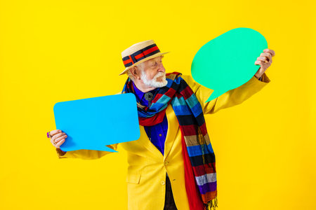 Cool senior man with fashionable clothing style portrait on colored background - Funny old male pensioner with eccentric style having funの写真素材