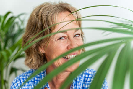 Beautiful mature senior woman at home, domestic life and leisure moments - 50-60 years old pretty...