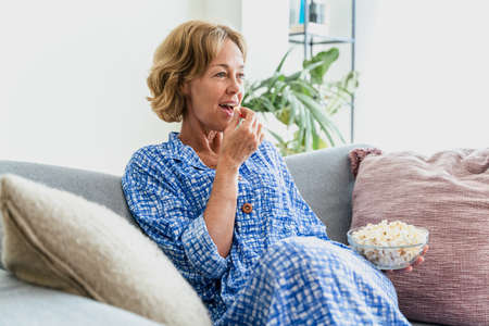 Beautiful mature senior woman at home, domestic life and leisure moments - 50-60 years old pretty...
