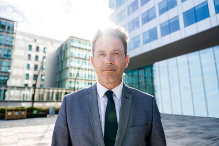 Handsome mature adult businessman with elegant suit