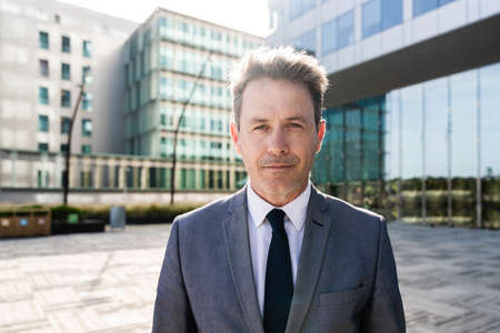 Handsome mature adult businessman with elegant suit