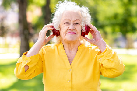 Cool, modern and happy old senior woman portrait - Elderly people in the age of 60, 70, 80 having...