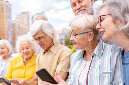 Group of happy elderly people bonding outdoors at the park - Old people in the age of 60, 70, 80...