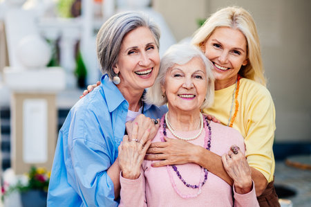Group of beautiful and happy senior adult women dating outdoors and meeting in the city - Stylish...