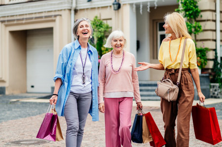 Beautiful happy senior women meeting outdoors and shopping in the city center - Pretty and joyful...