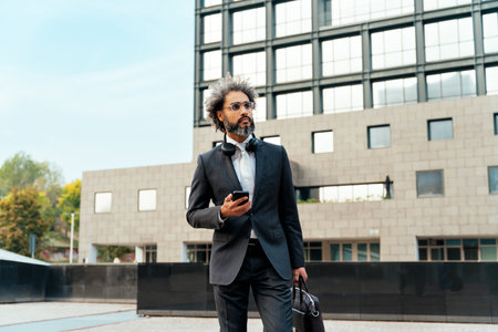 Young entrepreneur businessman walking outside his office after a long successful working day in the start up businessの写真素材