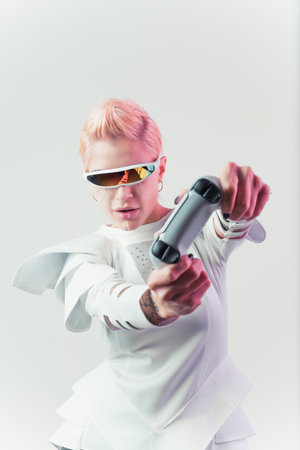 Representation of a bionic super human with advanced technology parts as vr visors and gadgets playing in a mixed reality training room. Futuristic cyberpunk evolution of human mankind and AIの写真素材