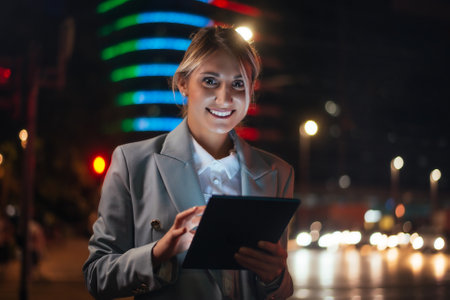 beautiful businesswoman working outdoors in a modern city.の写真素材