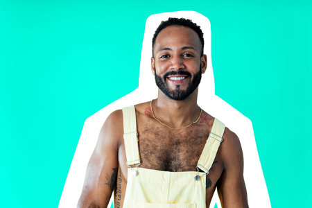 Image of a handsome young man posing on colored backgrounds wearing colorful trendy clothes. Concept about carefree, fashion and lifestyleの写真素材