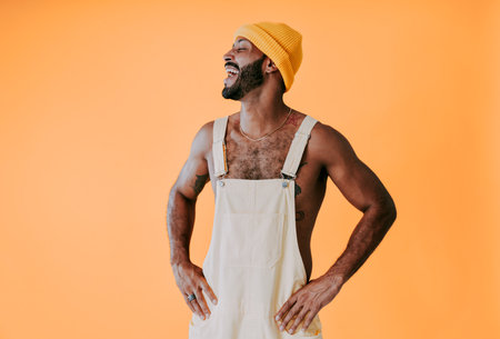 Image of a handsome young man posing on colored backgrounds wearing colorful trendy clothes. Concept...