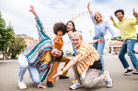 Multiracial young people together meeting and social gathering - Group of friends with mixed races having fun outdoors in the city- Friendship and lifestyle conceptsの写真素材