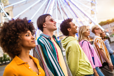 Multiracial young people together meeting and social gathering - Group of friends with mixed races having fun outdoors in the city- Friendship and lifestyle conceptsの写真素材