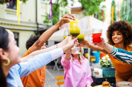 Multiracial young people together meeting and having party in a restaurant - Group of friends with mixed races having fun celebrating in a bar- Friendship and lifestyle conceptsの写真素材