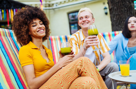 Multiracial young people together meeting and having party in a restaurant - Group of friends with...