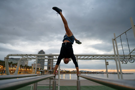 Sportive and athletic man doing functional training exercise at the outdoor gym - Adult athlete...