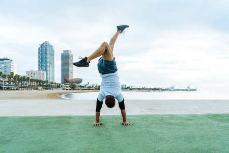 Sportive and athletic man doing functional training exercise at the outdoor gym - Adult athlete...