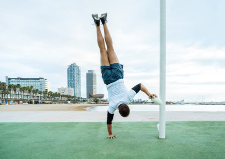 Sportive and athletic man doing functional training exercise at the outdoor gym - Adult athlete...