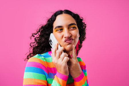 Beautiful young hispanic woman with diastema with colorful and cool style - Confident and interesting female with diverse and unique style, concepts about fashion, individuality and body acceptanceの写真素材