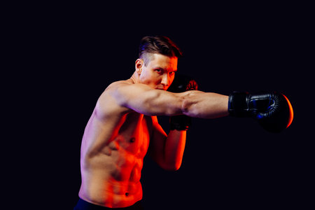 Athletic man with fit muscular body training in studio - Active man doing a workout, colorful...